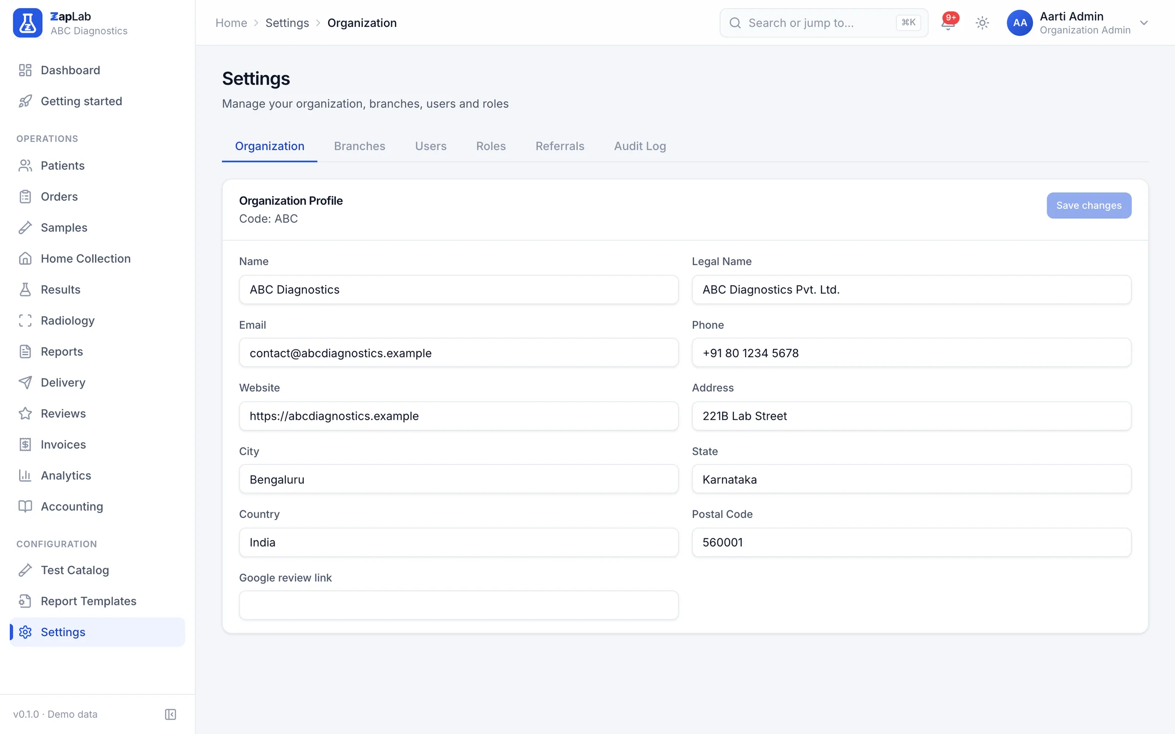 Settings with tabs for organisation, branches, users, roles, referrals and audit log, showing the organisation profile form